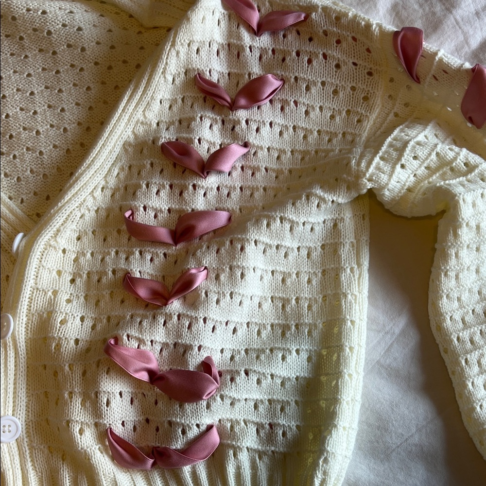 Elegant Cream Cardigan with Pink Ribbon Accents - Picture 5 of 9